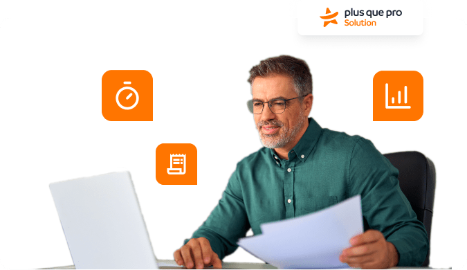 Chef d’entreprise utilisant un ordinateur pour gérer ses documents avec les outils Plus que pro, symboles de productivité et d’analyse autour de lui